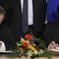 Armenian foreign minister Edouard Nalbandian (seated, L) and Turkish foreign minister Ahmet Davutoglu (seated, R) sign protocols as  (L to R) European Union Foreign Affairs chief Javier Solana, Swiss Foreign Minister Micheline Calmy-Rey, French Foreign Minister Bernard Kouchner, US Secretary of State Hillary Clinton, Russian Foreign Minister Sergueï Lavrov and Slovenian Foreign Minister Samuel Zbogar look on on October 10, 2009 in Zurich.  Turkey and Armenia's foreign ministers signed pacts to establish ties, in a first step to reconciliation after nearly a century of bitterness over their history.  AFP PHOTO / FABRICE COFFRINI